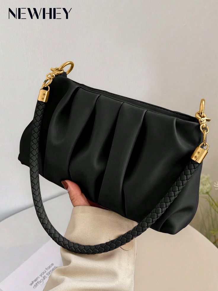 Black handbag with braided handle held by a hand against a neutral background, featuring the brand 'NEWHEY'.