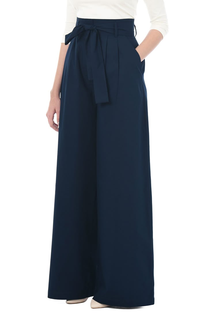 Navy wide-leg pants with a white top on a white background