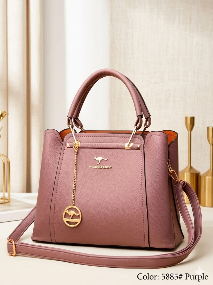 Purple handbag with gold accents on a neutral background