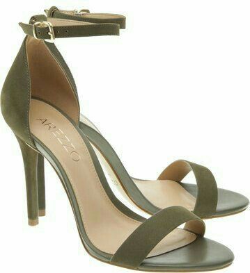 straps on a Green high-heeled sandals with thin white background